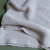 Manta de punto beige